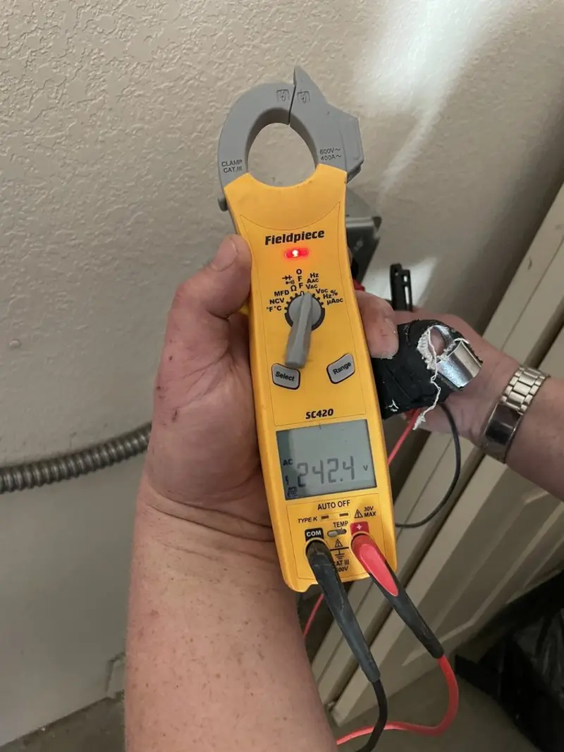 Voltage testing with clamp meter during Whole House Surge Protector in St. Thomas